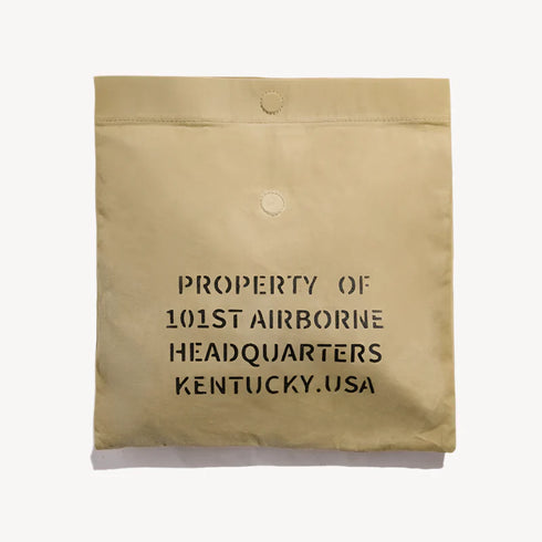 Vintage oil wax canvas handbag with khaki print, featuring a spacious interior and secure closure.